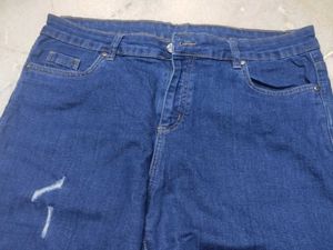 Distressed Blue Denim Jeans