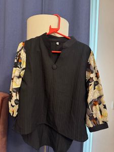 Unique Black Blouse with Patterned Sleeves