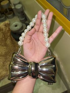 Bow Clutch with Pearl Handle