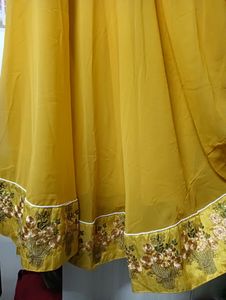 Embroidered yellow anarkali kurta with embroidered cream jacket