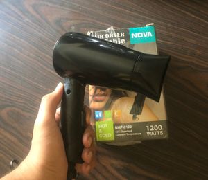 Nova hair dryer , with one year warranty , new pack piece and never used