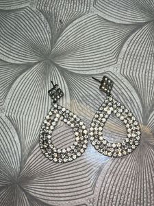 Diamond earrings with black beaded bracelet