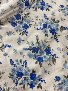 White skirt with a blue floral print