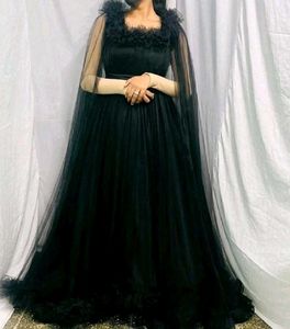 Elegant Black Gown with Cape