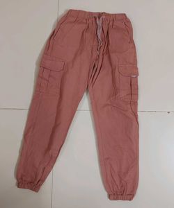 a pink cargo style joggers.