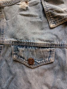 Distressed Blue Denim Jacket With A Touch Of 90s
