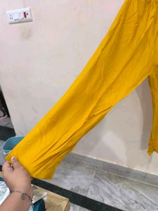 Mustard churidar pant.