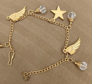 Golden Bracelet With Wings And Star Charms