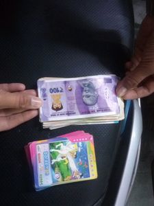 The Combo Of Playing Bank Money And Doremon Cards