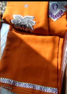 Elegant Orange Saree with Silver Embroidery