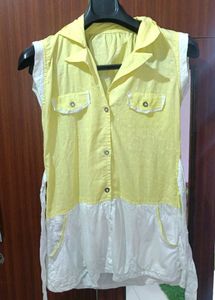 A Yellow Long Sleveless Top With 2 Pockets