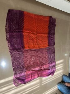 Lovely orange and purple bandhej Saree