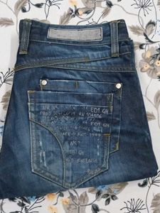 Distressed Blue Denim Jeans