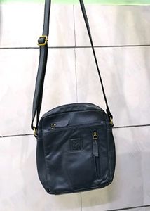 Good condition crossbody blue leather bag.