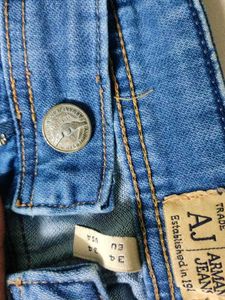 Distressed Blue Denim Jeans