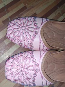 pair of traditional pink embroidered juttis