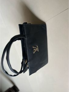Chic Black Handbag with Logo Detail