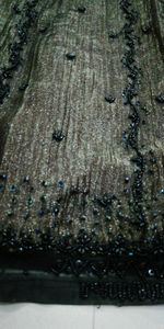 Black-copper Tissue N net skirt and blouse.