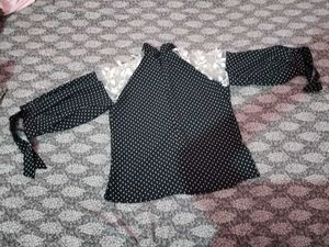 A Black Polyster Top With White Dots Nd Classic .
