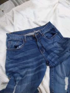 Distressed Blue Denim Jeans