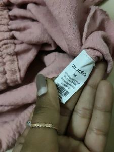A Pink Crop Top With Pullup Strings In The Size M