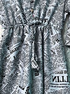 “Chic Newspaper Print Midi Dress with Flared Sleev