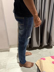 Ripped Blue Denim Jeans