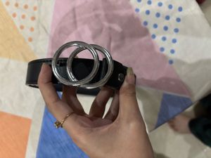 A black belt with silver buckle