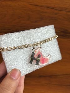 Bracelet with initial letter and real flower