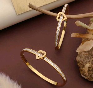 Gold Tone Flower Bangle Set