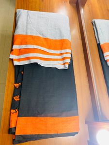 Black orange cotton blend saree with pompoms
