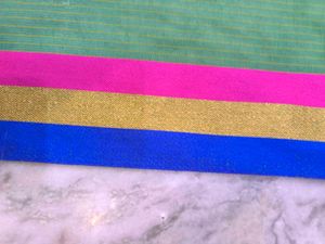 Green saree with multicolour details and glitter s