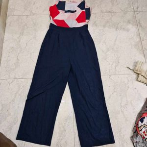 Womens Sleeveless Jumpsuit With Belt Included .
