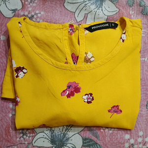 Yellow floral peplum top