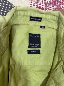 Combo of green shirt and denim jeans