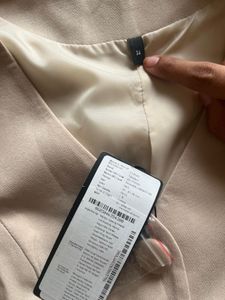 Trendy Beige Button-Down Vest