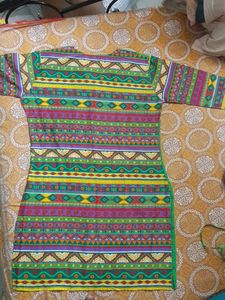 Beautiful Rayon kurti...front is green and back is multicoloured...totally new ...no flaws....not used single time...three quarters sleeves...side cut