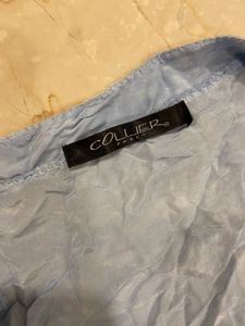 Branded buttoned top