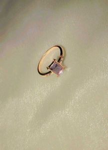 Elegant rose gold ring with a lavender stone.