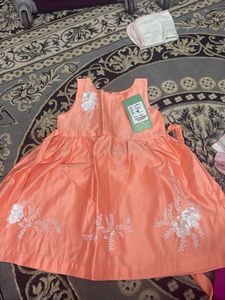 Cute Peach Dress with Floral Detail