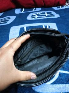 Black Quilted Carrot Sling Bag