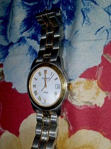 A gold and silver shining tissot watch