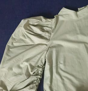 Bell hands green top