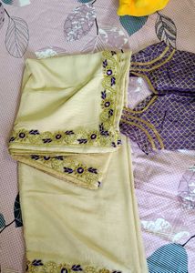 Elegant Creme Saree with Purple Blouse
