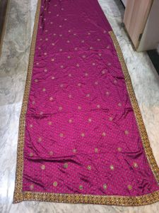 Megenta rajasthani tie-dye saree with bow blouse