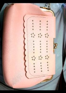 Pink kiss-lock coin purse