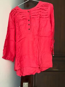 Red Top With Black Button In Front