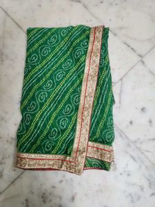 Green bandhni saree with golden border less