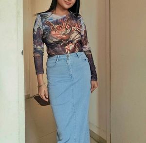 Angel Print Long Sleeve Top with denim skirt