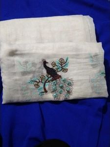 A Beautiful White Saree With Picococks Design